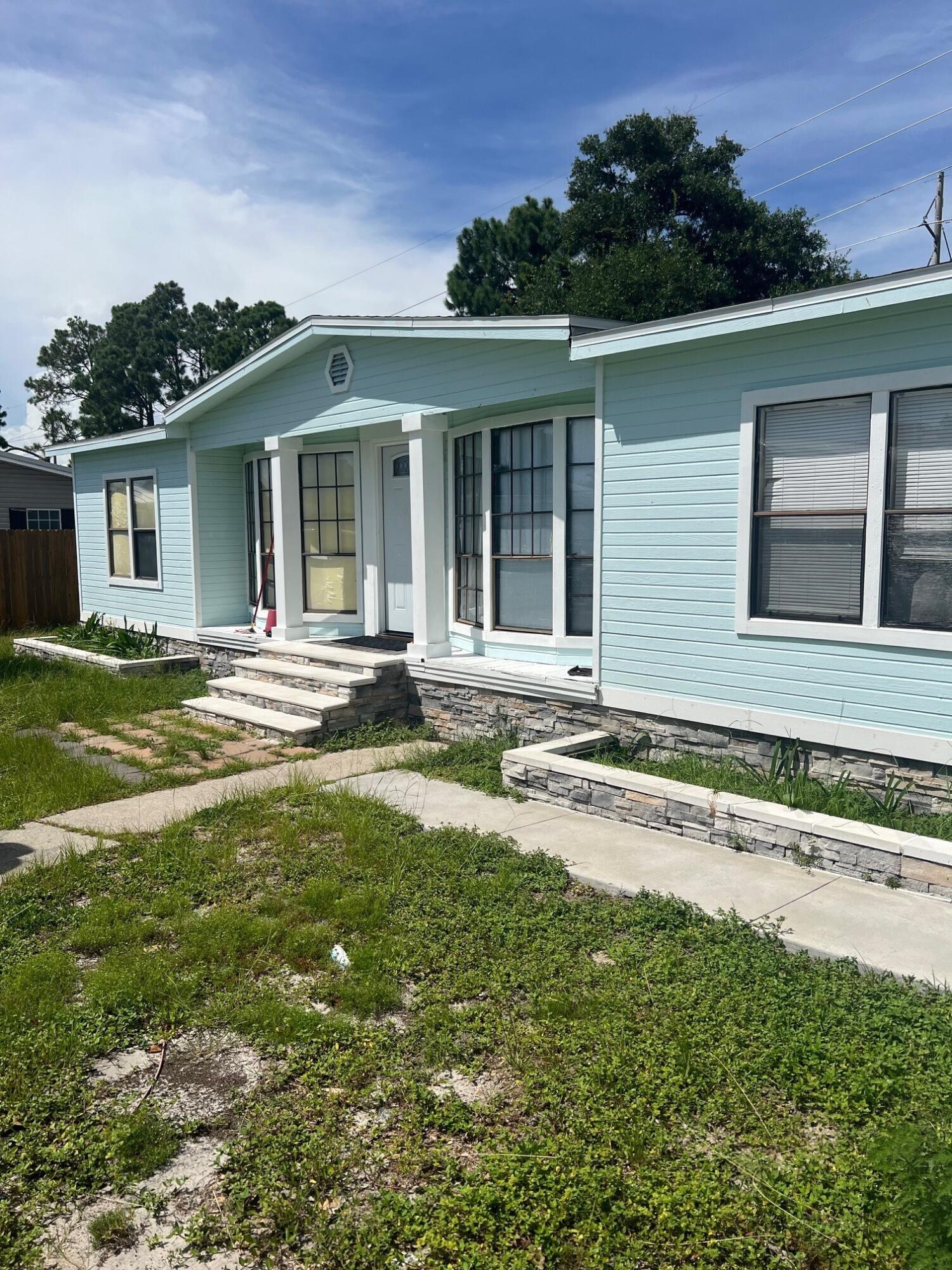 Back on the Market!! Located just a short drive to the Beaches, this is a 3-Bedroom/2-Bathroom Manufactured Home on a large Lot with enclosed Backyard space with a Metal Building for additional storage. HVAC, Water Heater, Flooring, Appliances along with the Roof were replaced within the last few years. Rear Deck and Driveway Stone. Gas available and Septic Tank on property. Tenant in place but on a Month to Month Lease so can be out in 30 Days.