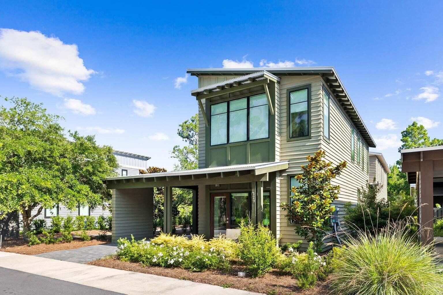 Contemporary home in Edens Landing. This beautifully designed, 3 bedroom 3 bath home is perfect for a primary residence or a second home. Nestled right next to Eden Gardens State Park on the Bay, you can indulge in tranquil gardens, walking trails, historic sites, and fishing off the pier. The home is centrally located to all area schools, K through 12, making it an ideal spot for families. Launch your boat or jet skis less than a mile away at the Point Washington access or enjoy the beach just 5 minutes from your doorstep. The contemporary design incorporates large expanses of glass to flood the home with natural light and the exterior is wrapped in natural cedar siding for a chic contemporary look. An attached covered carport offers convenient parking, and a screened porch provides the perfect spot for morning coffee or lounging. The downstairs features impressive 10 foot ceilings and premium LVP flooring throughout. The kitchen has shaker style soft closing cabinets, quartz countertops, and stainless Samsung appliances. Owners in Edens Landing enjoy access to a community pool, perfect for relaxation and socializing. Homes in this highly sought after community rarely become available and don't last long when they do. Don't miss your chance to own this exceptional property. Seller offering Mortgage rate buy down.