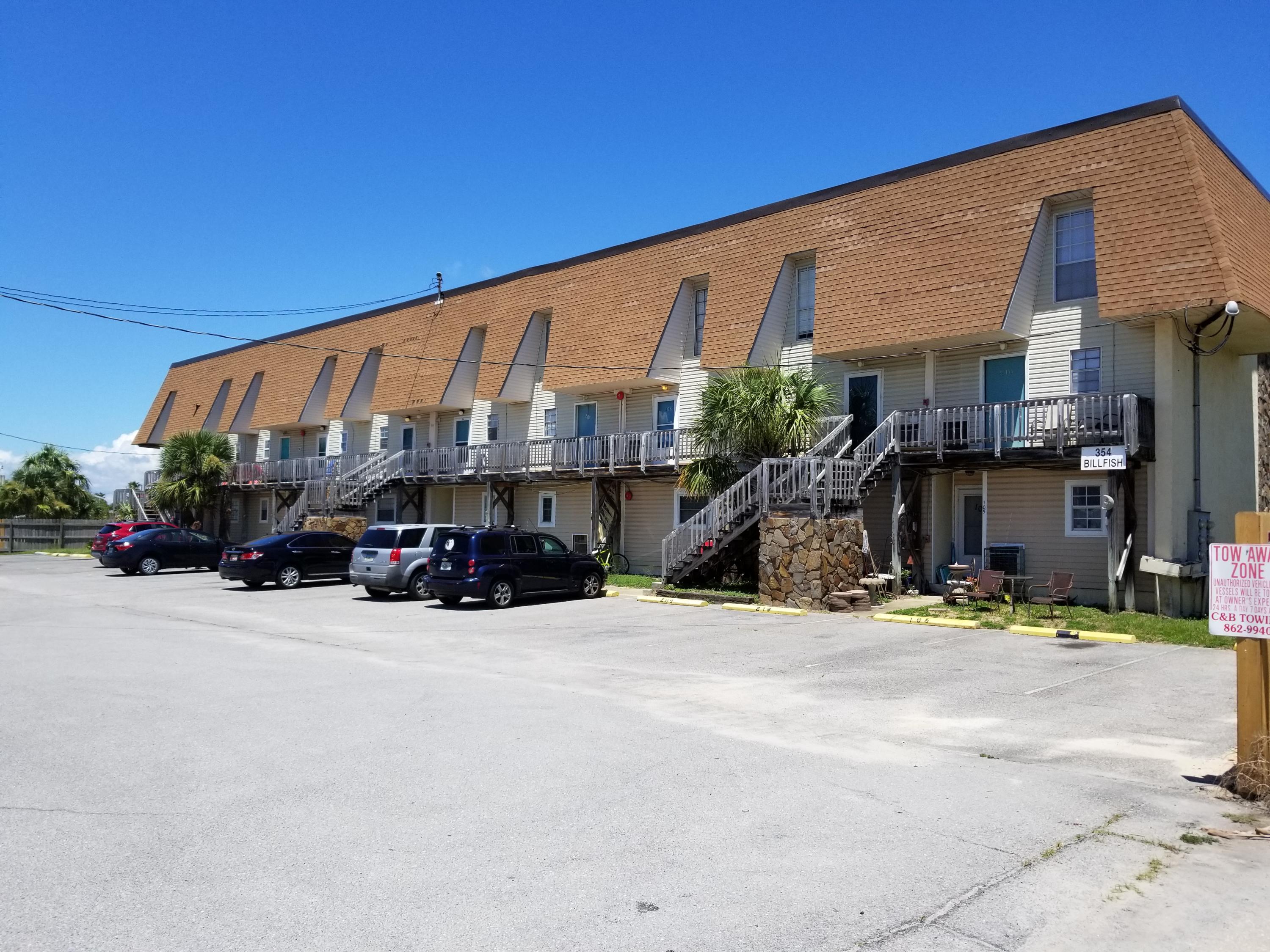 Cute unit on Okaloosa Island and just across the street from a pubic beach access. Walk to restaurants, entertainment and some shopping. Glimpse of the Intracoastal waterway from rear balcony and master bedroom. Good cabinet and counter space plus large pantry in kitchen. Each bedroom has private bath plus half bath off living area. Both baths have a tub with tile surround. Pretty wood laminate floors in living and dining areas. New carpet upstairs. Assigned parking plus guest parking. Okaloosa Island has bike/walking path and seven public access ways with boardwalks to the beautiful, white sand beach. This is one of the least expensive properties for sale on the Island. Don't wait, prices are continuing to increase, especially near the beach.