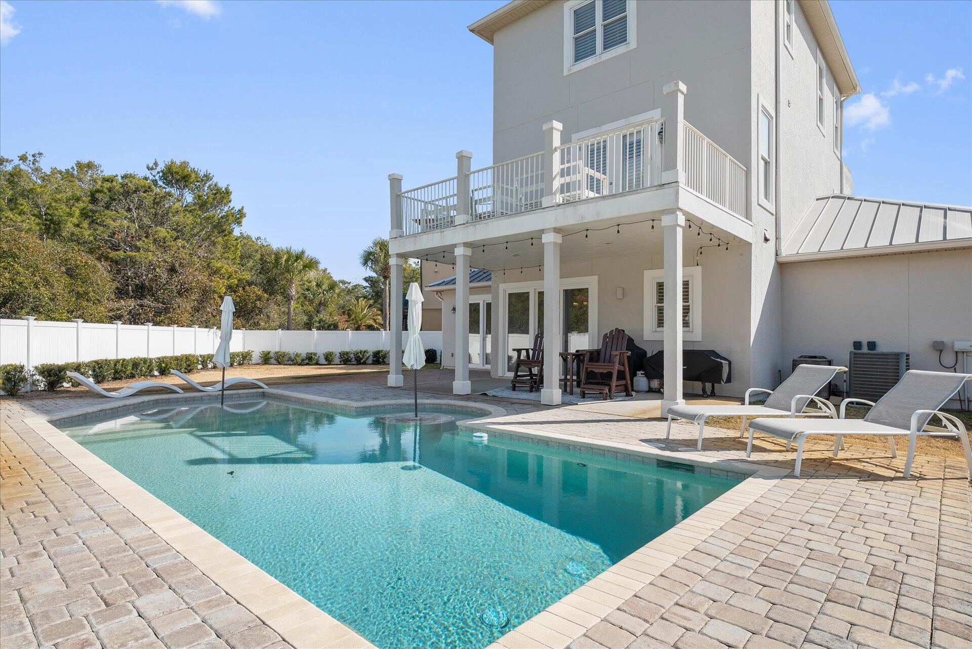 Welcome to your dream beach house, just one block off 30A in the sought-after community of Seacrest, Florida. With no HOA fees and private, deeded beach access, this home blends convenience, comfort, and the ultimate coastal lifestyle. This beautiful three-story home offers 3 bedrooms, 2.5 baths, and stunning Gulf views from the third-floor master suite. Situated at the end of a quiet cul-de-sac, the property ensures privacy with a tree-lined buffer backing to Camp Creek Golf Club. The expansive fenced backyard features a sparkling pool, perfect for relaxing or entertaining. Inside, enjoy two cozy living areas, a well-appointed kitchen, a half bath, and a one-car garage. The home features plantation shutters, crown molding, and beautiful tile flooring throughout. The second floor offers two bedrooms with a jack and jill shared bath and each bedroom has its own private balcony. The spacious master suite is located on the third floor with gulf views from the inside as well as the large balcony. This home would make a great primary residence, or a second home/investment property. Schedule your showing today.