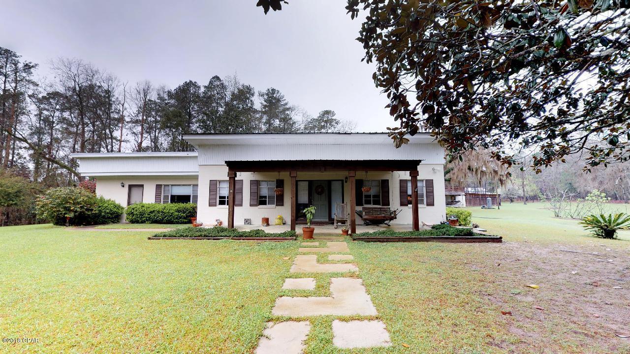 Peaceful 10-Acre Country Retreat with Pool - Just Outside Chattahoochee, FL Discover the charm of country living with this spacious 3-bedroom, 2-bath single-family home located just minutes from the quaint town of Chattahoochee, Florida. Enter through the winding tree lined road that sets the stage for the home that welcomes you at the end. Set on a beautifully wooded 10-acre parcel, this 2,131 sq ft home offers privacy, comfort, and room to grow. Built with durable concrete block construction and updated for modern living, this home features a metal roof and new windows, interior doors, and LVP flooring installed in 2018/2019. Inside, enjoy open living spaces perfect for both relaxation and entertaining. And don't forget to look up and see the beautiful wood designed ceiling. Step outsid outside to your own backyard oasis featuring a private pool, fenced yard, and storage shed for all your tools and outdoor gear. The shed has 2 attached covered bays perfect for vehicles, boats and other toy. ,The property uses city water with septic on the property, providing added independence and lower utility costs. Located in an area ideal for outdoor enthusiasts, this home is surrounded by exceptional opportunities for hunting, fishing, and boating. Chattahoochee itself is a charming small town nestled along Lake Seminole and the Apalachicola River, known for its natural beauty and peaceful atmosphere. And when you need a taste of city life, Tallahassee is less than an hour away, offering a full range of shopping, dining, medical facilities, and cultural attractions. It's also home to Florida State University, one of the state's premier institutions. Whether you're looking for a family homestead, a weekend getaway, or a place to embrace the outdoors, this property is a rare gem that combines rural serenity with convenient access to everything you need. Don't miss out - schedule your private showing today and start living the country lifestyle you've been dreaming of!