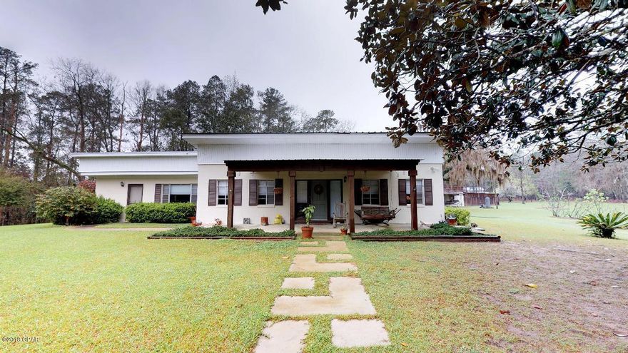 Peaceful 10-Acre Country Retreat with Pool - Just Outside Chattahoochee, FL Discover the charm of country living with this spacious 3-bedroom, 2-bath single-family home located just minutes from the quaint town of Chattahoochee, Florida. Enter through the winding tree lined road that sets the stage for the home that welcomes you at the end. Set on a beautifully wooded 10-acre parcel, this 2,131 sq ft home offers privacy, comfort, and room to grow. Built with durable concrete block construction and updated for modern living, this home features a metal roof and new windows, interior doors, and LVP flooring installed in 2018/2019. Inside, enjoy open living spaces perfect for both relaxation and entertaining. And don't forget to look up and see the beautiful wood designed ceiling. Step outsid outside to your own backyard oasis featuring a private pool, fenced yard, and storage shed for all your tools and outdoor gear. The shed has 2 attached covered bays perfect for vehicles, boats and other toy. ,The property uses city water with septic on the property, providing added independence and lower utility costs. Located in an area ideal for outdoor enthusiasts, this home is surrounded by exceptional opportunities for hunting, fishing, and boating. Chattahoochee itself is a charming small town nestled along Lake Seminole and the Apalachicola River, known for its natural beauty and peaceful atmosphere. And when you need a taste of city life, Tallahassee is less than an hour away, offering a full range of shopping, dining, medical facilities, and cultural attractions. It's also home to Florida State University, one of the state's premier institutions. Whether you're looking for a family homestead, a weekend getaway, or a place to embrace the outdoors, this property is a rare gem that combines rural serenity with convenient access to everything you need. Don't miss out - schedule your private showing today and start living the country lifestyle you've been dreaming of!