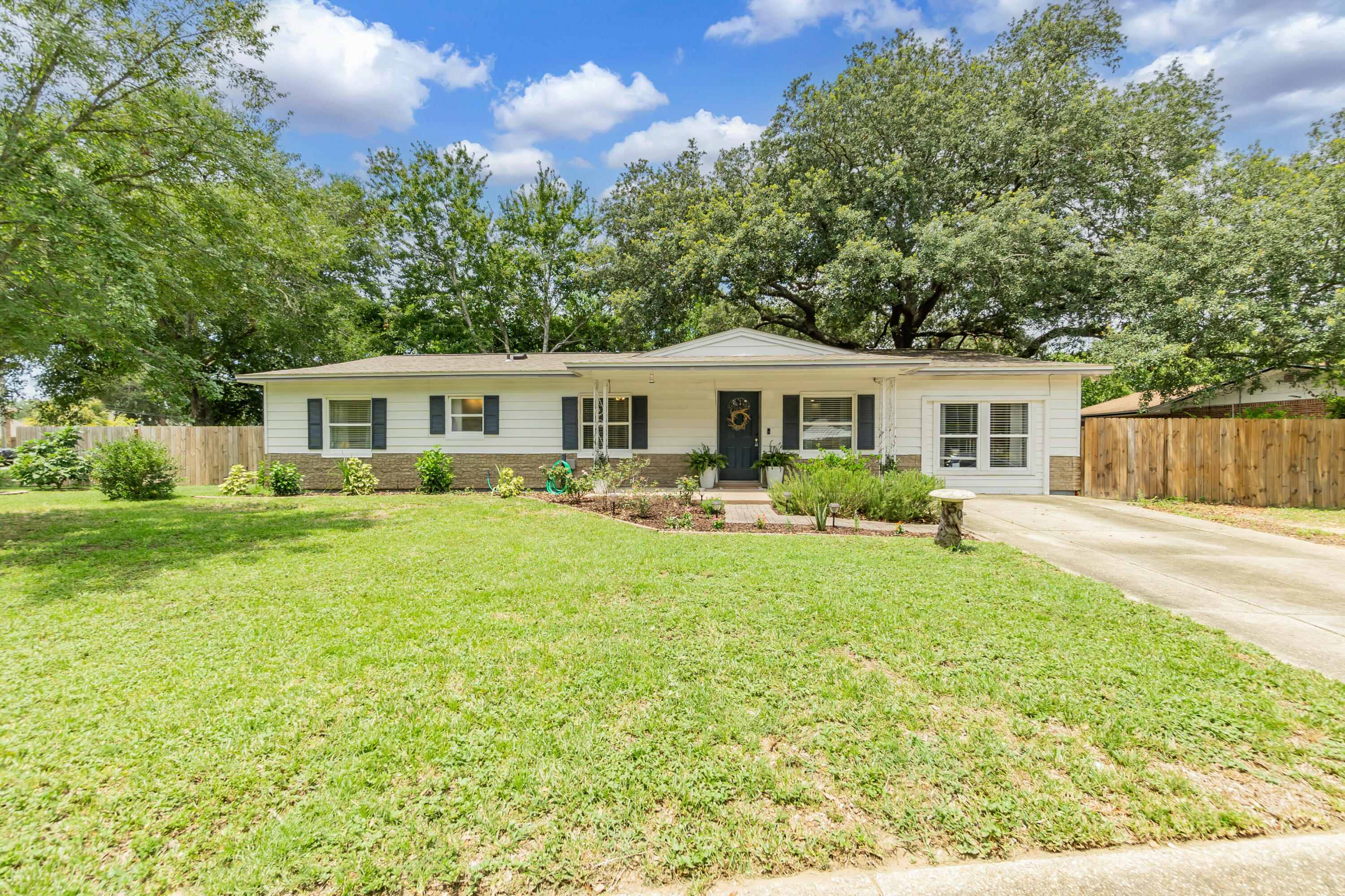 Welcome to this beautifully renovated gem! This home features updated bathrooms, New LVP flooring throughout, and stylish light fixtures. Enjoy energy efficiency and natural light with all new windows. The spacious open floor plan connects the living, dining, and kitchen areas seamlessly. The remodeled kitchen boasts granite countertops and top-of-the-line appliances. Located on a corner lot, this property has extra space and privacy. Brand new fence. Its just minutes away from Hurlburt and Eglin AFB, and just a short drive to the beach. Don't miss this beautifully updated home in prime location!
