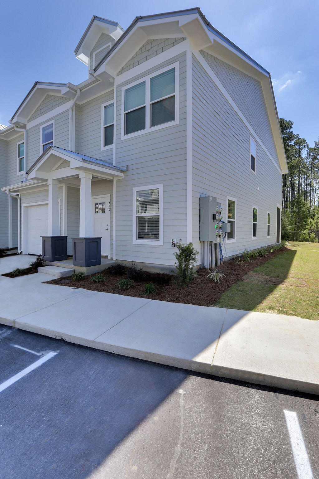 Ask us about Owner Financing. Brand new, beautiful END UNIT townhouse at Verandas in Freeport.  This home is over 1500 square feet with 3 bedrooms upstairs which includes the master bedroom and ensuite, laundry room and second bathroom.  The first floor is expansive with LVP flooring, tall ceilings, a half bath, kitchen with bright white quartz countertops and since this is an end unit, it had three windows for flowing natural lighting.  Out the back door and you will be in a private screened-in porch with access to the gated ponds.  Consider this house for your next home!