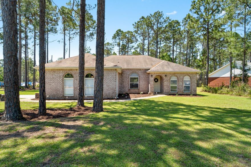 Welcome home to Holley by the Sea!  This gorgeous, 4-bedroom home on a corner lot home has been nicely updated and is ready for you!  On almost a half-acre and featuring a screened Florida room, you will love the updated landscaping and usable yard.  Inside, the flooring has been updated, water heater replaced, freshly painted (including baseboards), updated door fixtures, lighting (include outdoor fixtures), upgraded closet systems, new blinds throughout, and updates in the guest bath.  There's nothing to do here except relax and enjoy!