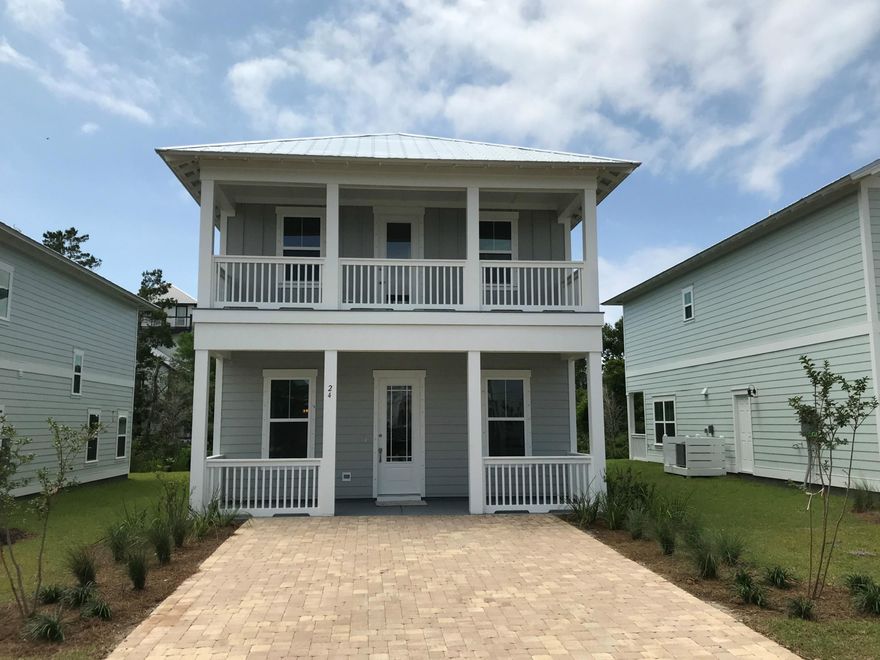 Welcome to Grande Point at Inlet Beach! This beautiful community is tucked away just North of Scenic Highway 30A. This is the Bayview floor plan featuring two stories and covered porches. As you enter this lovely home you will find an 10' ceilings & an open floor plan on the main level and beautiful hardwoods throughout common areas with plush carpets in the bedrooms. The kitchen has been designed with the gourmet chef in mind with quartz countertops, and stainless steel Electrolux appliances which include gas cooktop, wall oven and dishwasher. The kitchen is open to the large dining area and has a large walk-in pantry for storage. The dining area opens out to the covered back porch. Upstairs you will the laundry room with washer and dryer hookup. Two bedrooms have a shared bath with quartz countertops and wood flooring. The large master suite has his and hers walk-in closets with wood shelving, a large walk-in shower with frame glass enclosure, and  dual sink vanity with quartz countertops. You can enjoy mornings and a quiet evening on your upstairs covered porch accessible from your master suite. This home has been well constructed with a metal roof, hurricane fabric shield with a durable HardiePlank fiber cement siding with aluminum wrapped fascia and vinyl soffit. With energy conservation in mind this home includes a tankless natural gas hot water heater, ceiling fans in family room and master bedroom, each additional bedroom has been blocked and pre-wired for ceiling fans. A 10 structural warranty and One year builder warranty is included.  **Pictures, photographs, floor plans, elevations, features, colors and sizes are approximate for illustration purposes only and will vary from the homes as built. Home and community information including pricing, included features, terms, availability and amenities are subject to change and prior sale at any time without notice or obligation. For Move-In/Completion Estimates: Ready dates are estimates only**