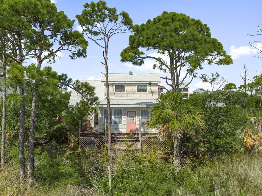Scallop from your own front yard at Cape San Blas. Bay waterfront views with expansive views from the den and back porch. Community dock adjacent to the property. Sleeps from 4 to 7 people. Plenty of boat or trailer parking space on the front of the lot. Property is in AS IS condition. Property has been priced for this condition.