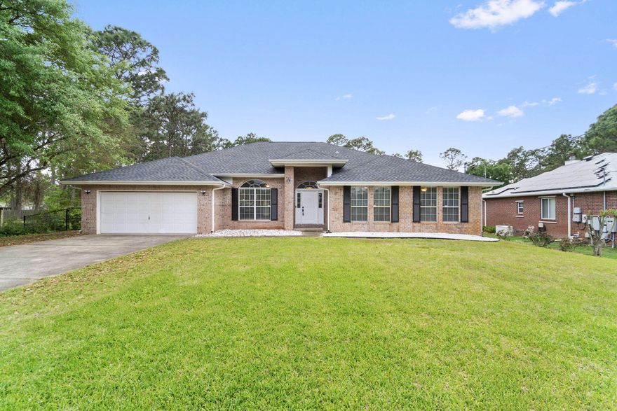 Discover a serene sanctuary at 2363 Sunrise Drive, Navarre, FL, where coastal charm meets modern comfort. This expansive 2,992 sq ft retreat boasts four spacious bedrooms and three luxurious full baths, offering ample space for relaxation and rejuvenation. Immerse yourself in the harmonious design of this home, where open living spaces flow effortlessly into each other, creating a welcoming ambiance for gatherings of any size. The large windows invite an abundance of natural light, illuminating every corner and providing breathtaking views of the surrounding landscape. The well-appointed kitchen serves as the heart of the home, perfect for culinary adventures and delightful meals. Each bedroom offers a private haven, ensuring restful nights with soothing decor and ample storage.