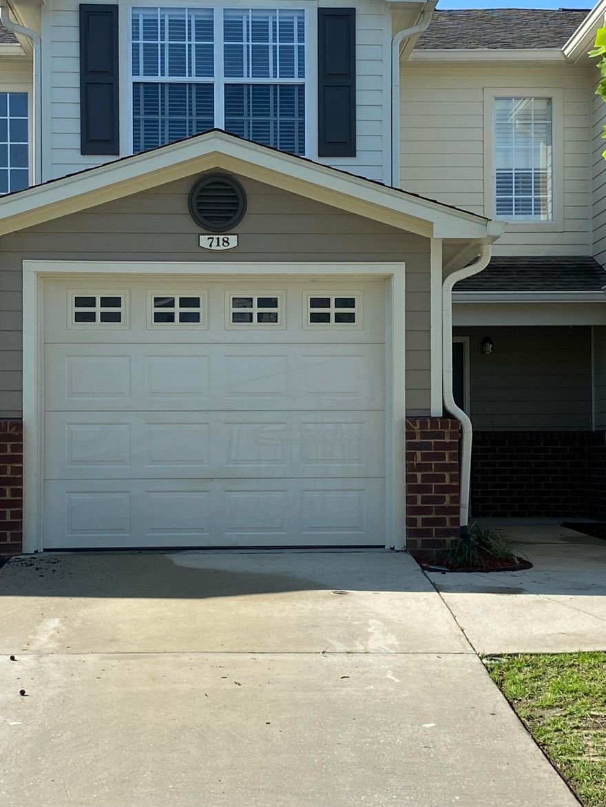 South of I-10.  This lovely well maintained townhome is a must see.  Located in the very well maintained Eagles Landing Subdivision.  This unit offers upgraded wood flooring in the main living area.  Upgraded stainless refrigerator and small breakfast bar in the kitchen.  Also includes washer and dryer.  The two owners suites are located upstairs.  Both have their own full bath and walk in closets.  There is a community pool and yard service.