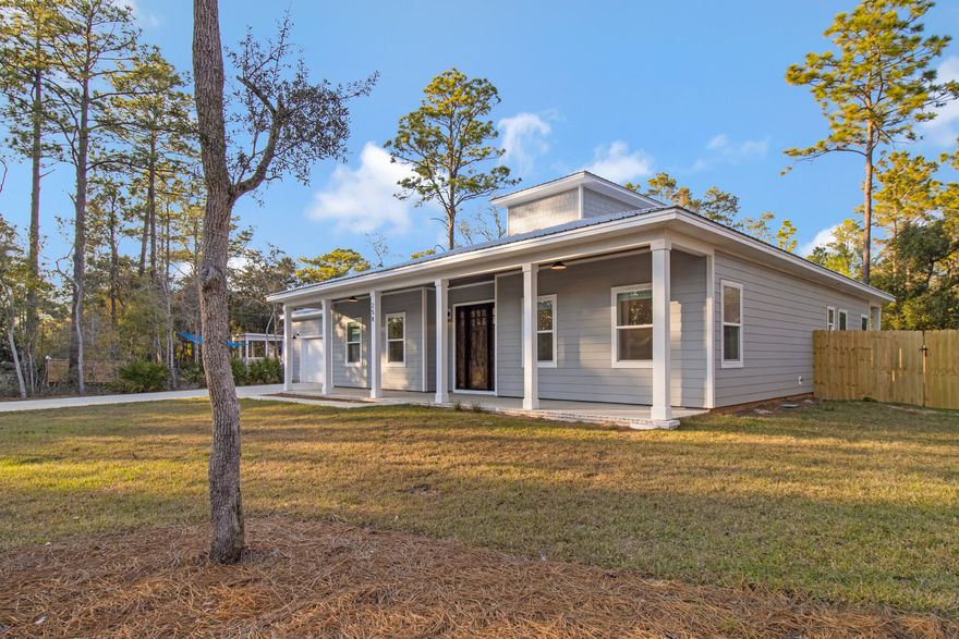 Gorgeous custom built 3 bedroom, 2 bath home in a mature neighborhood close to the water is one of a kind boasting exquisite finishes including hardyboard siding, 1000 square feet of covered porches with tongue & groove ceilings stained to match the custom front door, custom showers with penny tile, Delta fixtures, built-in Roomba storage & charger, farmhouse lighting fixtures, farmhouse kitchen sink, tongue & groove accent walls, soft close cabinetry, 10' farmhouse doors, interior trim, custom windows, 12' garage with shop lighting, keypad entry system, privacy fenced back yard, lawn sprinkler, remote control interior lighting, metal roof by Solid Roofing, Inc., granite counter tops, and a crows nest built for energy efficiency.  Close to shopping, schools, and entertainment.