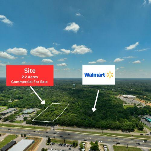 Exceptional commercial opportunity located within the city limits of Crestview. This 2.2-acre outparcel sits prominently on the high-traffic corridor of Highway 85 North at the intersection of Industrial Drive, with an average daily traffic count of approximately 29,000 vehicles, verified by the Florida Department of Transportation.Positioned directly adjacent to the future site of a brand-new Neighborhood Walmart set to break ground within the coming year, this parcel offers outstanding visibility and access in one of Northwest Florida's fastest-growing areas.