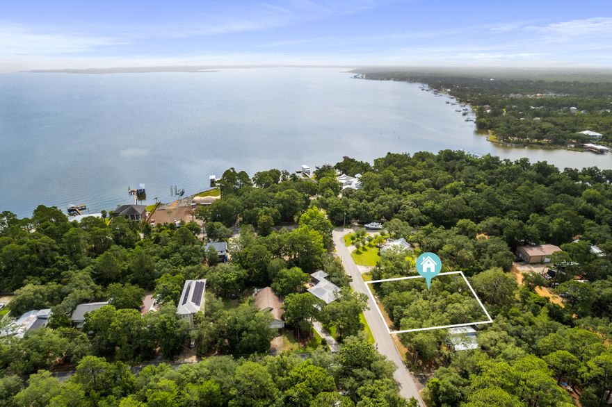 Beautiful Lot in a quaint, quiet neighborhood just waiting for your new home! Located just off of the Bayou and convenient to Ascension Sacred Heart, The shops at Grand Boulevard, Golf Courses, Restaurants and the relaxing lifestyle Sandestin and Destin have to offer! This lot is on a paved road and in a nice setting  with no HOA! Buyer or Buyer's agent to verify all information deemed important.