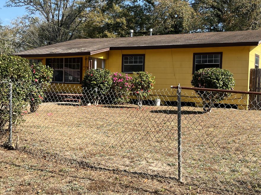 THE HOUSE IS SELLING AS IS, NEEDS WORK, BUT A NICE SIZE AND LOTS OF PARTENTIAL, GREAT FIXER UPPER AND A GOOD RENTAL IF INTERESTED.THE LOT CONSIST OF LOTS 1&2, A NICE SIZE YARD SITUATED ON A CORNER LOT.  (Please note the interior measurement may not be quite accurate, please measure for yourself and satisfaction, also not sure about the hot water heater if it is elec or gas as that is boxed in).  The house has the old time gas heater in the living room.