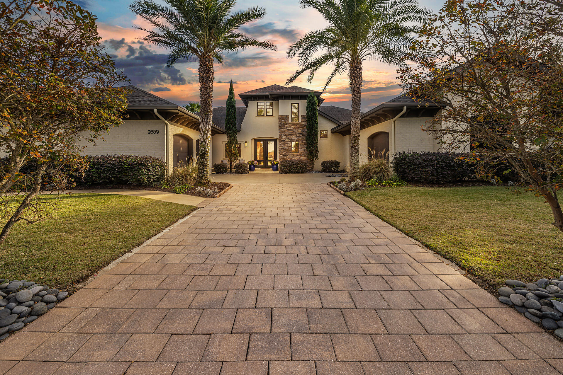 Welcome home to this EXQUISITE custom built master piece located in the highly sought-after gated community of Grand Pointe Manor. Upon entering, you will be captivated by the paved entrance and oversized 3 car garage accompanying the modern contemporary design details that have not been spared both inside and out! Inside, you'll immediately be struck by the grand high ceilings that meet the natural stone gas vented fireplace and a chef's dream kitchen boasting top-of-the-line appliances with ample counter space and a generously sized island. This home also offers a separate office space/study with built ins on the main level and a bonus flex space upstairs along with an attic that provides a ton of storage! The premier, private master bedroom suit includes 2 large his and her walk-ins, a huge bathroom with separate shower and a relaxing garden tub... perfect for those spa days! The expansive and open floor living areas impeccably transition both indoor and outdoor spaces making it the perfect setting for both memorable family gatherings and entertaining! The beautiful outdoor enclosed lounge area oasis includes a saltwater heated pool, shower, cabana with full swing bed and projector screen all surrounded by luscious landscaping and magnificent lighting. Not only is this home luxurious, it's conveniently located a few minutes from Gulf Breeze Hospital/Andrews Institute, and 25 minutes from Sacred Heart and Baptist, West Florida Hospital, Gulf Breeze's A School District and our pristine emerald waters and white sand beaches. This rare opportunity has arrived, so don't let it slip away! Under contract with contingencies accepting back up offers