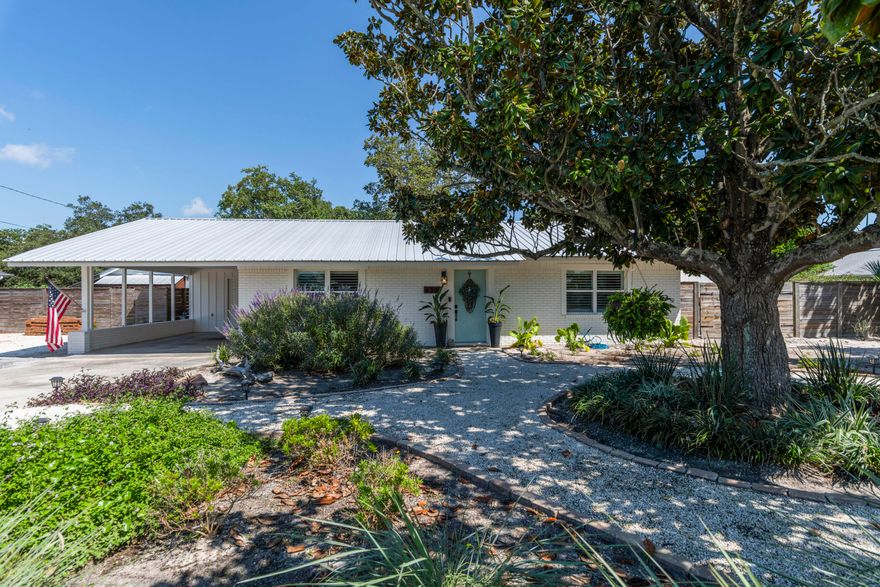 This house is a MUST SEE!! Welcome to your FULLY renovated beach cottage OASIS..the perfect home for a full time residence or as a short term rental machine. Located just steps to the beach this home has SO much to offer for BOTH indoor & outdoorliving at it's best. The main house has been fully updated with beautiful quartz kitchen counter tops, stainless steel appliances, cedar plank tongue and grooveceilings, tile plank floors, new solid wood doors throughout, custom built closets in both bedrooms, a fully remodeled bathroom, new windows in 2017 withplantation shutters, 2017 roof, 2019 fence, fresh paint throughout and new gas hook up for the stove & NEW tankless water heater. Then step out back to yourown tranquil private resort that i