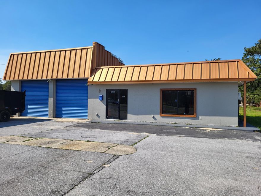 Building has office area, 2 bay warehouse area with 2 garage doors, storage area in rear of building, paved parking, free standing metal sign, existing median cross over in front of property.  Building is approx 1,700 sqft block building.  Owner will be installing a new AC unit in office area.  Lease is NNN.