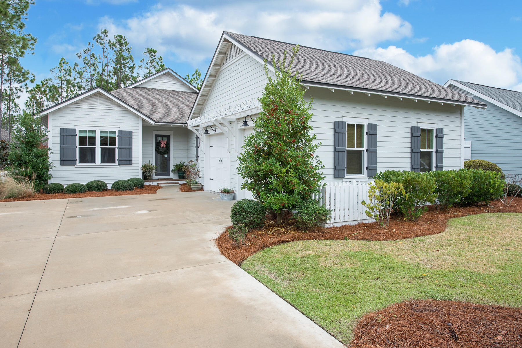 Watersound Origins home that backs up to walking paths, green space and a coveted community park. 4br/3ba with 10' ceilings, hardwood floors throughout and quartz countertops in the kitchen and bathrooms.