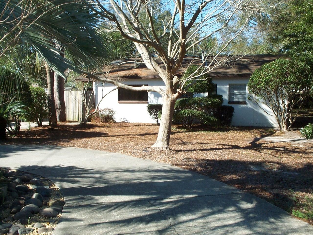 RENOVATED.. NEW Flooring, NEW interior painting, NEW interior doors, NEWER HVAC, NEW bathrooms. You'll love this cute home inside and out. Circular driveway and lovely landscape is the front focal point. Interior is all spruced up and ready to move in - it's like a new home inside. Area between the home and the back yard is separately privacy fenced and ideal as an outdoor entertainment area. There is also an exterior door that leads into the laundry room from this lovely outside area. ... This home being offered ''As Is'' .. Check out the on-line photos. ...