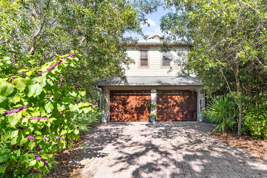 Amazing 3-bedroom home with additional carriage home for another bedroom and full bath in the beautiful gated community of Summer Ridge. Summer Ridge is a prime location in 30A within a mile (0.70) to the beach  and Gulf of Mexico. Ed Walline Beach Access is straight down 393 South. You are also in close vicinity to Gulf Place, which is a nice convenience for shopping & dining. Summer Ridge South is a private, non-rental coastal community with just 12 homes and good sized lots nearly 1/4 acre. The beautiful oak trees and foliage provide a serene environment. This is a true Florida cottage with nice architectural elements like wood windows with transoms, hardiboard siding & metal roof. There is a stunning great room with beautiful vaulted wood ceilings with intricate beams & wood flooring. Living area is nice and open with great natural light and has a fireplace for the winter months. There is a dining area for four and a granite breakfast bar which is perfect for casual dining. The kitchen offers plentiful wood cabinets, granite counters, added backsplash and stainless steel appliances. The master bedroom is conveniently located on the ground floor and is quite spacious. Master bedroom has direct access to the patio from the double doors. Enjoy your coffee outside near nature. There are double closets and an ensuite master bathroom with double vanity, garden tub and separate shower. The door from the bathroom opens up to a great outdoor shower which is a must for coastal living. Another ideal feature is the expansive screened-in porch with beautiful wood ceilings and a peaceful setting backing up to trees. There are plentiful outdoor areas in addition to this like the wraparound covered patio at the entrance, a large open deck, hot tub deck with pergola and a balcony off the guest bedroom on the second floor. 

The upper level encompasses two spacious guest bedrooms, a Jack & Jill bathroom and good storage. The main home also features a laundry room on the ground level with a full size washer and dryer and storage and a half bath. There is welcoming curb appeal and a detached two car garage with a carriage house above it featuring a full bedroom and bath. Overlook the hot tub deck from the entry. This is ideal for guest visiting or overflow for family as they can have added privacy. This quaint community is one of the most pristine on 30A. There is a community pool and paver stone pool deck to enjoy. You are located on the west end away from the hustle and bustle but just minutes away from Gulf Place, a prime entertainment hub for 30A. Gulf Place offers great shopping, Sunrise Coffee, YOLO Board for bike and board rentals, and also restaurants like A Perfect Pig. The Gulf Place amphitheater has great summer concert series and events to enjoy and Shunk Gulley Restaurant & Bar is across from Gulf Place too. Everything you need for that coastal lifestyle you desire is within reach. This home is a great value for the community and area - do not miss out!