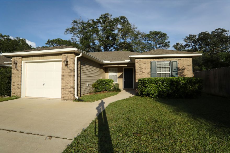 Custom-built 2008 townhome that is located between both Hurlburt Field and Eglin AFB! Home features beautiful tray ceilings (accented with crown molding) in both the dining area and master bedroom. Porcelain tile flooring can be found in the foyer, dining area, kitchen, both bathrooms, and the laundry room. Garage will be painted, carpets will be cleaned, and interior has been freshly painted. Any sheds, outbuildings, and lawn pumps are being sold in ''as is'' condition and no value will be added. Buyer to verify room measurements.
