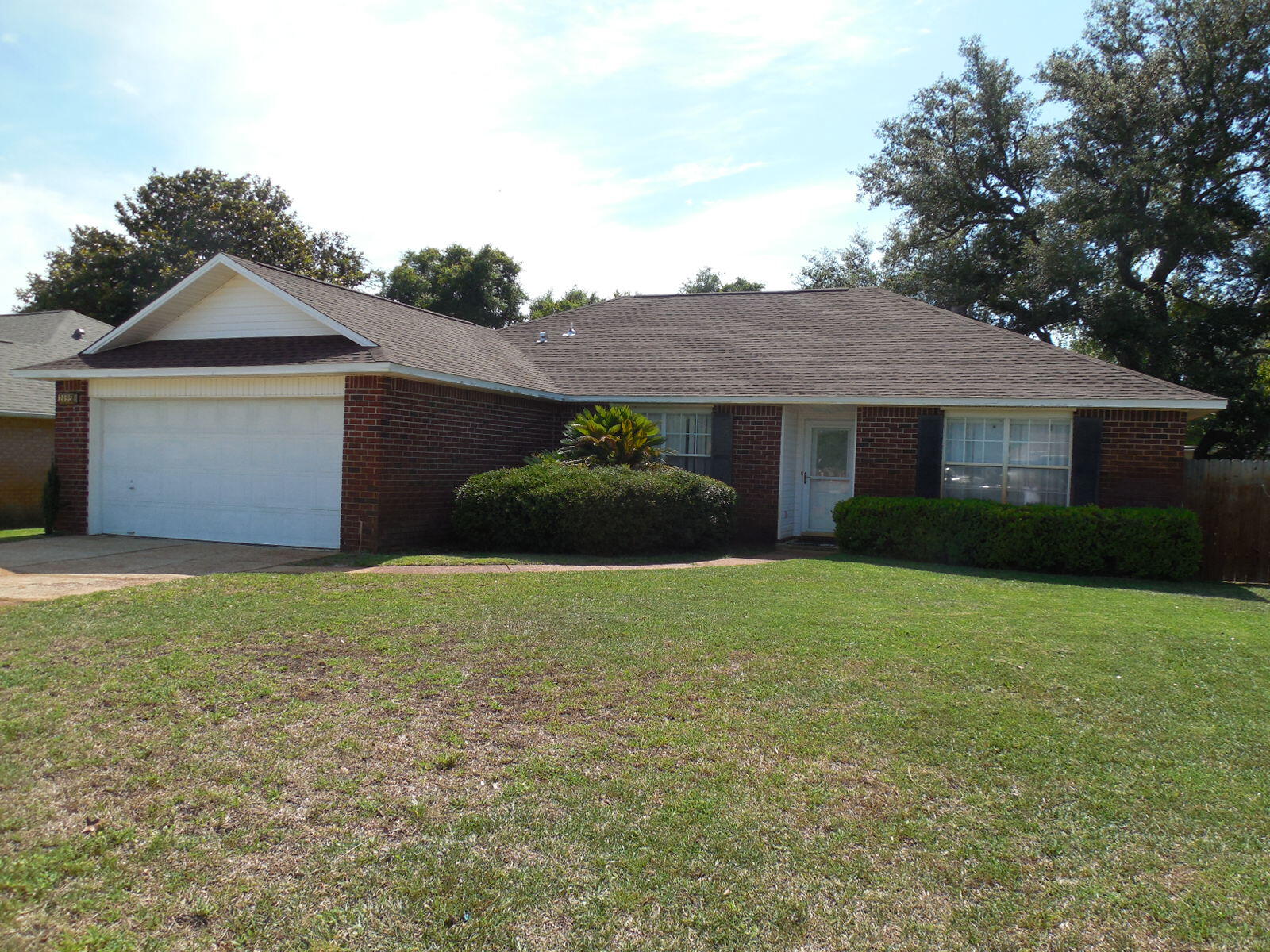 Don't miss this move in ready home nestled in a serene waterfront subdivision, just minutes from Hurlburt Field! This charming 3-bedroom, 2-bathroom home offers a generous 1,706 square feet of open living space and a large 2-car garage. Step inside to find a bright, freshly painted interior, complemented by a brand-new roof and newly installed HVAC system, ensuring your comfort and peace of mind.The spacious living area is perfect for relaxing with family or entertaining friends, with vaulted ceilings and a cozy fireplace that appears to have never been used. Sliding glass doors provide a seamless access to your private outdoor space with a fully fenced back yard. The kitchen is equipped with all the necessary essentials and opens up to a cozy dining area, making mealtime a breeze. With a split floor design, you can enjoy a private master suite where you'll find a large walk-in closet and a well-appointed in suite bathroom. On the other side of the house, you will find a laundry room, 2 additional bedrooms and a nice size full bathroom adding to the home's functionality.
Nature enthusiasts will love the common outdoor space, which features a lovely picnic area, gazebo, and dock access, perfect for fishing or just enjoying the scenic waterfront views. Whether you're an outdoor adventurer or simply seeking a tranquil, inviting space to call home, this property offers the best of both worlds. Don't miss out on this fantastic opportunity to join the welcoming community of Sandy Beach Estates.