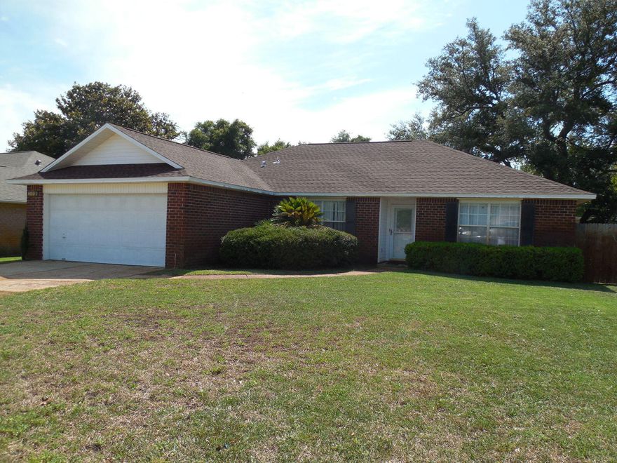 Don't miss this move in ready home nestled in a serene waterfront subdivision, just minutes from Hurlburt Field! This charming 3-bedroom, 2-bathroom home offers a generous 1,706 square feet of open living space and a large 2-car garage. Step inside to find a bright, freshly painted interior, complemented by a brand-new roof and newly installed HVAC system, ensuring your comfort and peace of mind.The spacious living area is perfect for relaxing with family or entertaining friends, with vaulted ceilings and a cozy fireplace that appears to have never been used. Sliding glass doors provide a seamless access to your private outdoor space with a fully fenced back yard. The  kitchen is equipped with all the necessary essentials and opens up to a cozy dining area, making mealtime a breeze. With a split floor design, you can enjoy a private master suite where you'll find a large walk-in closet and a well-appointed in suite bathroom. On the other side of the house, you will find a laundry room, 2 additional bedrooms and a nice size full bathroom adding to the home's functionality.
Nature enthusiasts will love the common outdoor space, which features a lovely picnic area, gazebo, and dock access, perfect for fishing or just enjoying the scenic waterfront views. Whether you're an outdoor adventurer or simply seeking a tranquil, inviting space to call home, this property offers the best of both worlds. Don't miss out on this fantastic opportunity to join the welcoming community of Sandy Beach Estates.