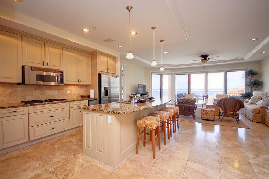 This magnificent 4BD/4BA West End Villa is located in Grand Dunes North Tower the premier, gated and rental restricted resort in Miramar Beach Florida. This Gulf front unit on the 5th floor of residences is sitting 8 stories above sea level, providing incredible views of the sugar white sands and emerald green waters of the Gulf of Mexico. Being sold furnished thus allowing the buyer to move in and start enjoying the coastal lifestyle immediately. Beautifully appointed with travertine flooring in the foyer, living areas, kitchen, hallways & baths, granite tops cover the custom wood cabinetry with soft close drawers. Upgraded lighting fixtures illuminate the chef's kitchen which is adorned with premium stainless steel appliances,