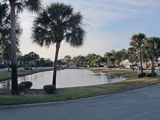 Welcome Home to this beautiful, well maintained and freshly painted brick home in the highly desirable waterfront community of Marsh Harbor! Enjoy lake views from your front porch and take a 2 minute stroll to reach the neighborhood's deeded access to it's private boardwalk, pier and community beach directly on the Santa Rosa Sound!! Easy entry to the water for swimming, fishing, paddle boarding, kayaking or canoeing! Or if you'd prefer to just relax on the beach, bring a blanket or chair and enjoy the beauty and wonder of the magnificent Sound! The dock has built in seating where you can sit and watch the gorgeous FL sunsets along with the myriad of marine and wild life in the area! You'll also enjoy a peek-a-boo view of the sound from the home's private back deck! The home is
