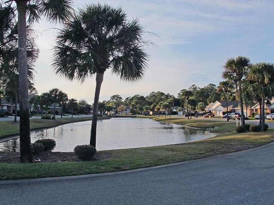 Welcome Home to this beautiful, well maintained and freshly painted brick home in the highly desirable waterfront community of Marsh Harbor!  Enjoy lake views from your front porch and take a 2 minute stroll to reach the neighborhood's deeded access to it's  private boardwalk, pier and community beach directly on the Santa Rosa Sound!!  Easy entry to the water for swimming, fishing,  paddle boarding, kayaking or canoeing!  Or if you'd prefer to just relax on the beach, bring a blanket or chair and enjoy the beauty and wonder of the magnificent Sound!  The dock has built in seating where you can sit and watch the  gorgeous FL sunsets along with the myriad of marine and wild life in the area!  You'll also enjoy a peek-a-boo view of the sound from the home's private back deck!  The home is