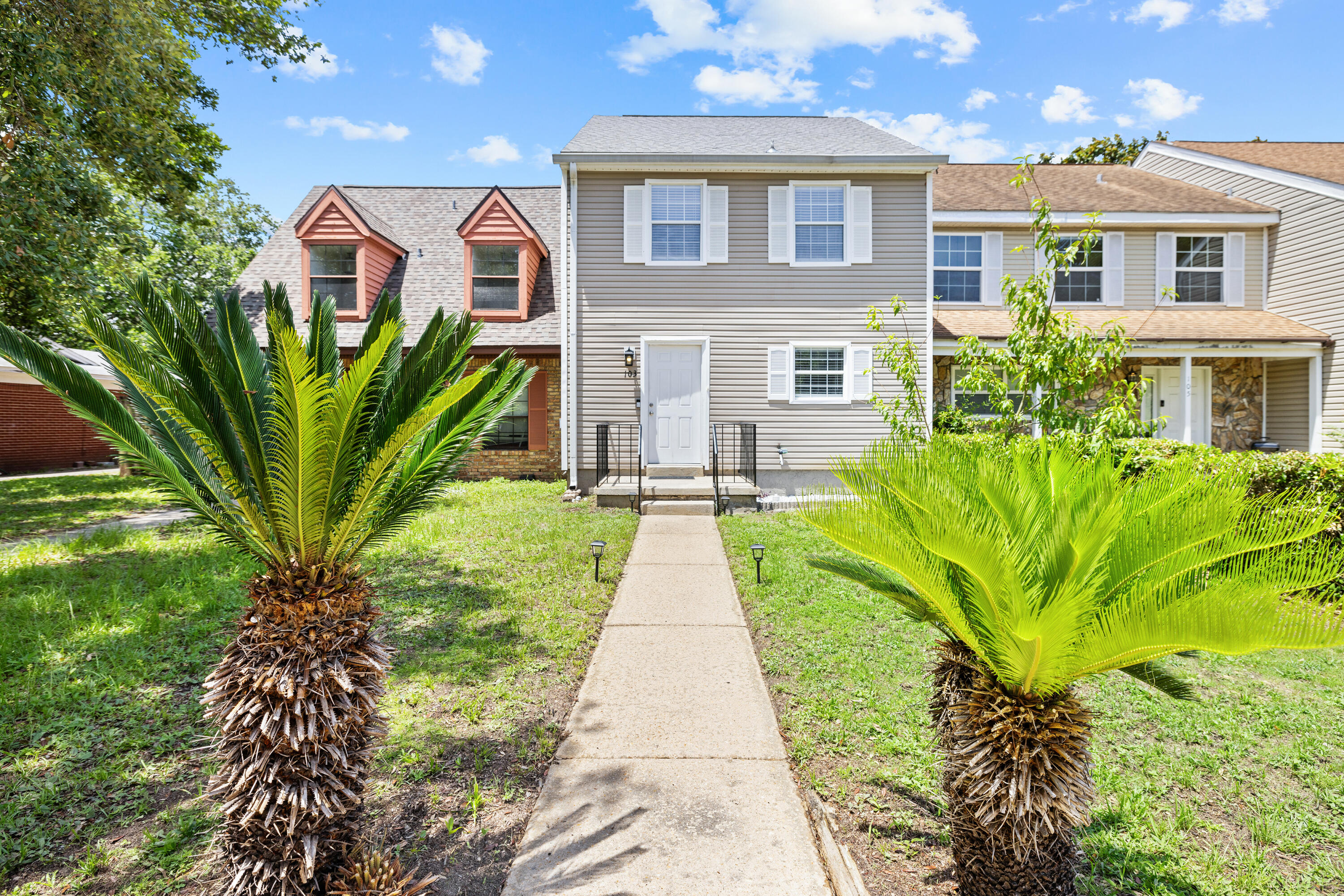 Highly Motivated Seller, also offering a home warranty! This beautiful MOVE IN READY townhouse offers 1,344 square feet of stylish living space. Enjoy the benefits of NO HOA in this centrally located gem, perfect for modern living and entertaining. The downstairs area features a seamless flow with LVP flooring between the living room, dining room, and kitchen creating a spacious and inviting atmosphere. The updated kitchen includes stainless steel dishwasher, oven range, and hood, with a washer and dryer hook-up, and a convenient half bath on the main floor. Upstairs, you'll find two large bedrooms, with walk-in closets, full bathroom with an adjoining powder room connecting them. The fully fenced backyard offers privacy and is perfect for pets. shed for all your garden needs and beach toys. The glass sliding doors that open up to a concrete patio is ideal for grilling and setting up outdoor living spaces, while the shaded area with trees and grassy lawn provides a serene outdoor environment. Situated on a quiet street hidden off the beaten path, this bright and airy unit benefits from plenty of natural light throughout. Centrally located, it provides easy access to local amenities, shopping, and dining.