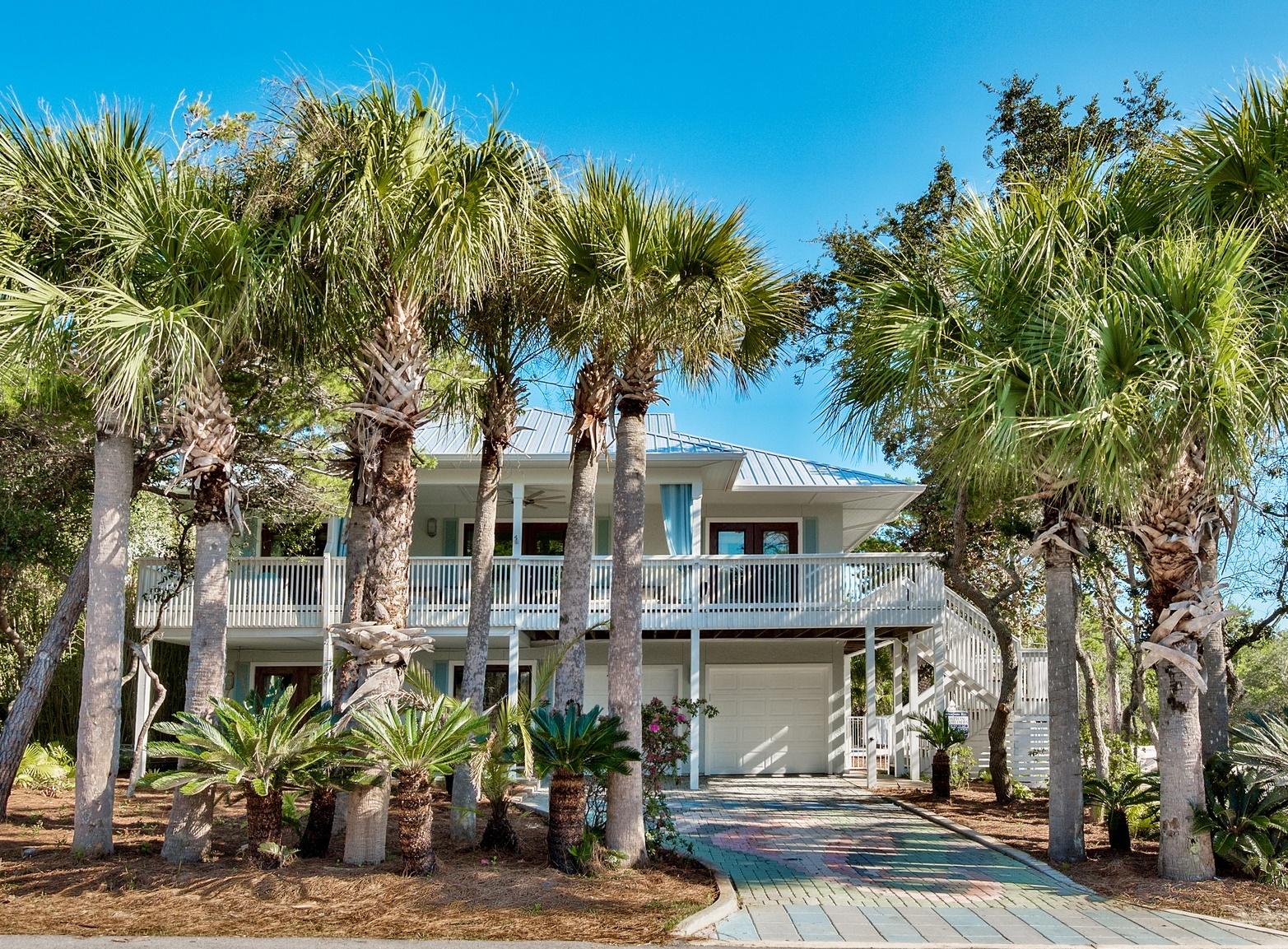 WELCOME HOME to your DREAM Beach oasis! From the moment you step into this newly renovated masterpiece, that has been completely redesigned for maximum comfort and beauty, you will feel at home. Just like new, from the new roof, 'LifeProof' 100% waterproof core plank flooring in warm wood tones to the new baths, rooms, kitchen, appliances, this home is perfect!Artfully redesigned to accommodate multi-family retreats, the living areas and spaces for relaxing are remarkable!Featuring first floor entrance into a very spacious living/dining area with mini kitchen. Elegant full bath. Separate bedroom with private bath, additional bunk room, super fun game room, large laundry for complete living area. Second floor opens to open concept living,