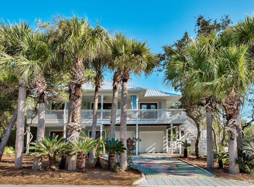 WELCOME HOME to your DREAM Beach oasis! From the moment you step into this newly renovated masterpiece, that has been completely redesigned for maximum comfort and beauty, you will feel at home. Just like new, from the new roof, 'LifeProof' 100% waterproof core plank flooring in warm wood tones to the new baths, rooms, kitchen, appliances, this home is perfect!Artfully redesigned to accommodate multi-family retreats, the living areas and spaces for relaxing are remarkable!Featuring first floor entrance into a very spacious living/dining area with mini kitchen. Elegant full bath. Separate bedroom with private bath, additional bunk room, super fun game room, large laundry for complete living area. Second floor opens to open concept living,