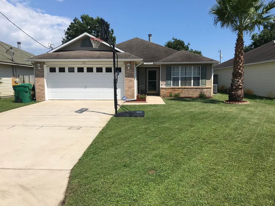 Move in Ready right outside the base gate! This upgraded well maintained 3 bedroom home is waiting for new owners. Enjoy cooking in the large open kitchen/dining area. Big Pantry, newer stainless appliances, and an upgraded extra deep sink, along with a water filtration system are just some of the benefits. 18 inch neutral tiles throughout the living spaces and the owner is throwing in the washer and dryer too! The master has double vanities, elegant large tile in the bath, and is big enough for a king sized bedroom suite! Sizable 2 Car garage with an ample driveway for all your needs. Great lawn for pets with thick grass and nice landscaping, sprinkler system and a fully fenced in backyard. Quiet street in an optimal location, with NO hoa fees!