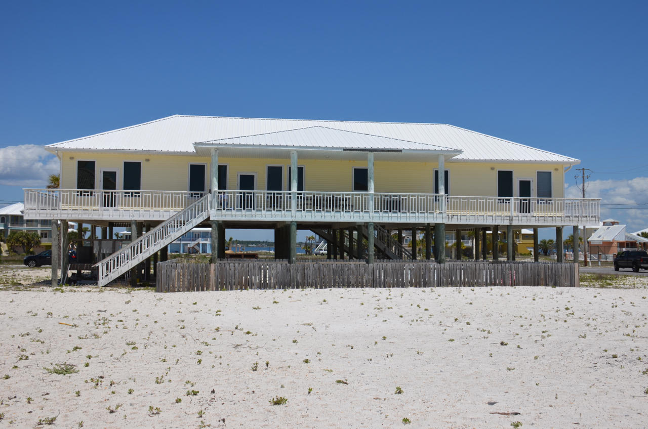 GULF VIEWS. POOL. This sprawling 2684 sq. ft home with 5 bedrooms, 4 bathrooms and a Pool is a rare find on Navarre Beach. Updated with New Hardwood floors, Granite counter tops, back splash and new appliances. Some other features include, corner lot, over 1500 sq ft of wrap around porches to take in the views, high ceilings, Impact windows and doors, fully furnished, 2 covered entry points into the home, plenty of parking and storage for all your toys and more. Surrounded by Emerald Green waters and Sugar White Sands, easy access Gulf of Mexico, miles of bike paths, Gulf Islands National Seashore, Navarre Beach fishing pier make this the perfect beach home.Buyer to verify all information to buyers satisfaction including but not limited to sq. footage, room sizes, lot size, zoning etc.
