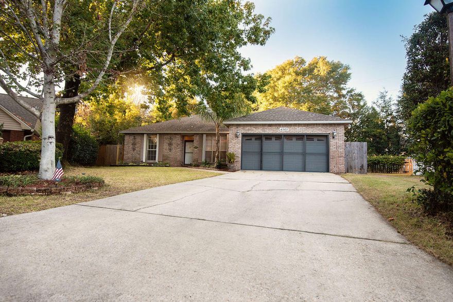 Tucked away on a peaceful cul-de-sac, this charming 3-bedroom, 2-bath home offers the perfect blend of comfort and convenience--just minutes from schools, bases, shopping, and beaches. Inside, you'll find updated finishes, including neutral paint colors and durable vinyl plank flooring. The spacious living room features a gas fireplace and flows seamlessly into the dining area and eat-in kitchen. The kitchen is equipped with a center island, granite countertops, a tile backsplash, and white appliances. The split floor plan provides privacy, with the primary suite on one side of the home. It boasts a generous bedroom with barn doors, a walk-in closet, and an updated ensuite bathroom with a tiled walk-in shower and double vanity. Two additional bedrooms and a shared hallway (click more link)  bath are situated on the opposite side. Enjoy extra living space in the heated and cooled Florida room. The two-car garage features a screened door. Step outside to your private, expansive backyard retreatcomplete with an in-ground pool, firepit area, and shed. A double gate allows easy access to the backyard from Range Road.