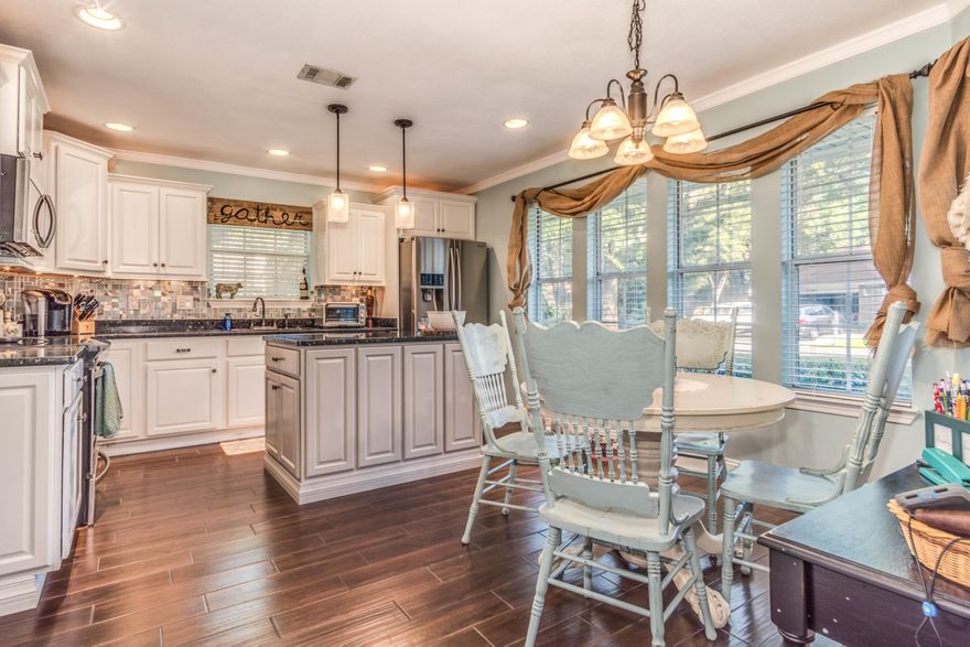 Stunning 5 Bedroom, 3.5 Bath home located in the Highly Desired and Gated Neighborhood of Parkwood Estates,just a short walk to the Award Winning Bluewater Elementary! Located on a large lot with mature trees. 1st Floor Master Suite has his and her closets, dual sink master bath, separate shower and jetted tub. Bonus suite with a large bedroom, full bath, family room and kitchenette that can serve as a Mother-In-Law Suite, home-schooling area, or entertainment space. Beautiful ceramic wood plank tiles throughout first floor of main home, all flooring in home is less than 3 years old, New Insulated Siding, New A/C system for bonus suite, and various other upgrades. Complemented with two fireplaces, breakfast nook, formal dining, and screened lanai great for entertaining. This is a MUST SEE!