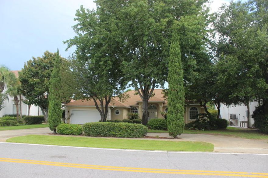 Deep Water with a dock for a large boat the exclusive Indian Bayou subdivision. This is the best of both worlds both boating and golf. Indian Bayou has 27 Holes of some of the pristine golf in the panhandle.This custom home features a split bedroom floor plan with tile in the foyer, kitchen and bathrooms. Bamboo floors in great room, office, formal dining room. Carpet in bedrooms.The custom kitchen features Granite counter tops with substantial amount of cabinetry for service to the dining room, breakfast area and a pass through to the covered patio overlooking the pool. This is a great opportunity to own in Indian Bayou.