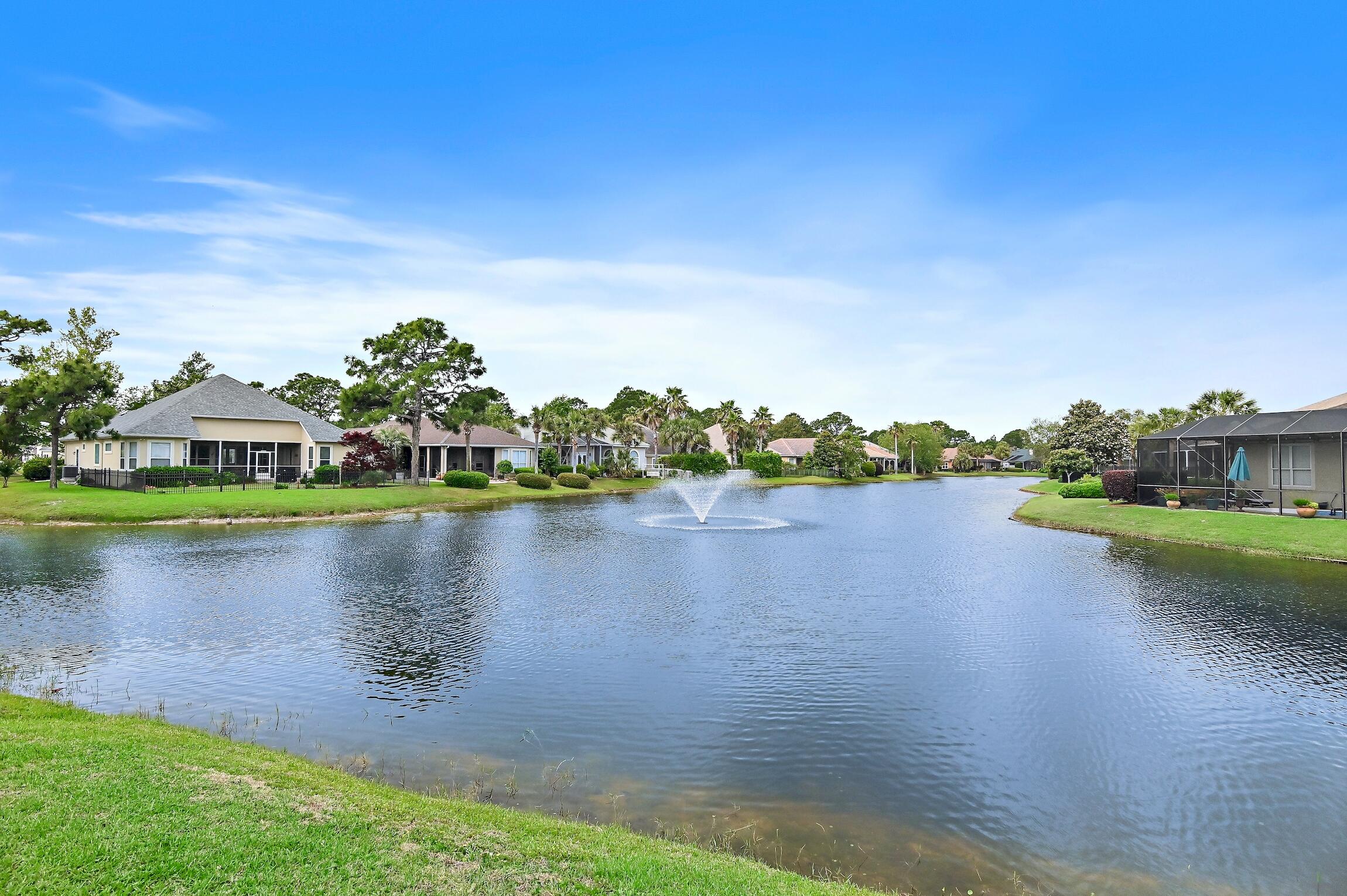 Welcome to this charming lakefront home in the private gated community of Emerald Lakes and just minutes to the beach! You'll love this spacious custom-built home, with a freshly repainted interior, featuring 3 bedrooms, 2 full baths, dining room & a living room with serene lake views. Enter through the double front doors to find 10 foot ceilings, custom crown molding, a built in wet bar, gas fireplace & more! The breakfast nook offers a gorgeous view of the lake. The primary bedroom, which also offers a view of the lake, features a walk-in closet, a large bathroom with dual vanities, whirlpool tub & separate shower. You'll love the oversized 2 car garage & large attic space. Neighborhood amenities include a resort style swimming pool, pickleball & tennis courts, basketball court, (more) pavilion/grilling area, a kid's playground & sidewalks throughout. Conveniently located to Destin and Miramar Beach with shopping, restaurants, and championship golf available. Roof replaced in 2019, new attic insulation-2025, new sprinkler timer in 2025.