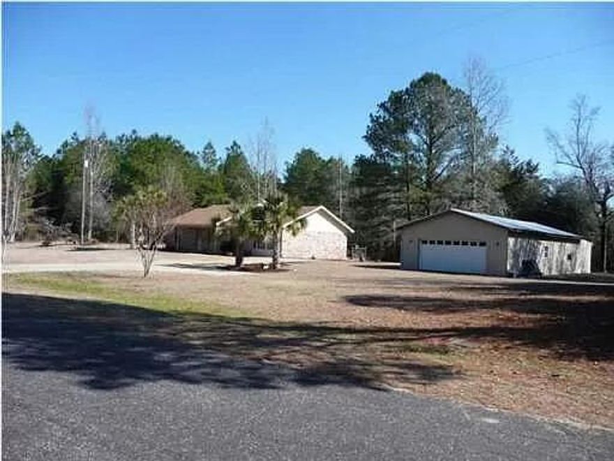 8323 Old Ebenezer Rd, Laurel HIll, is a single family home that contains 1,884 sq ft and was built in 1989. It contains 3 bedrooms and 2 bathrooms. It is 15 minutes North of the rapidly growing Crestview without all the traffic.It was remodeled to expand the kitchen and Master Bedroom in 2014. It has recently been painted and the appliances and bathrooms were updated as well.The large metal building (25 X 60) has 240 volt power and is already wired for all of your shop needs. It also includes a bonus room which is not included in the total sq ft of the house.
