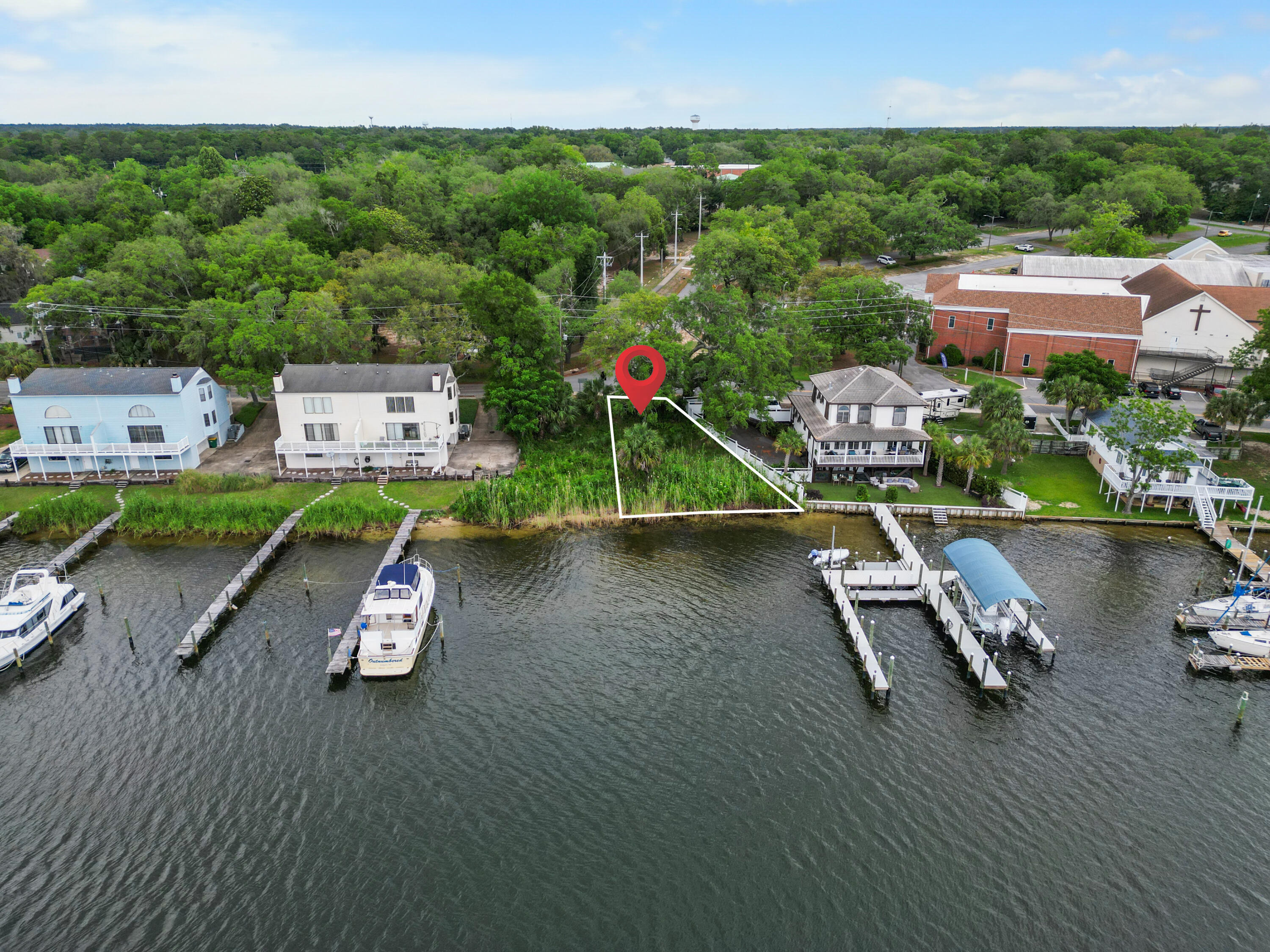 Do not miss this rare opportunity to own a buildable waterfront lot in the heart of Niceville--perfect for long-term value and lifestyle upside. Located on Bayshore Drive, this .17-acre property features approximately 66 feet of direct frontage and will allow a three story, 3000 sq ft home on Boogie Bayou, to allow you to enjoy being just minutes from Oak Marina, The Wharf Restaurant, and the highly rated Niceville High School--making this location ideal for both families and future tenants.With no HOA restrictions and favorable setbacks (approximately 25 feet; buyer to verify), investors have the flexibility to build a high-demand waterfront property for resale or rental. Its central location on Bayshore Dr. places it in a well-established area that continues to attract both homeowners and vacationers alike.
Niceville is renowned for its natural beauty and outdoor activities. Residents can enjoy the Turkey Creek Nature Trail, a serene 2.3-mile boardwalk perfect for walking and wildlife observation. For more adventurous pursuits, Fred Gannon Rocky Bayou State Park offers hiking, kayaking, and camping experiences amidst Florida's unique ecosystems. Waterfront lots in Niceville are increasingly scarce, especially this close to the water with direct bay access. Whether you're land banking, developing to sell, or adding a premium asset to your portfolio, this is a smart move in a growing market.