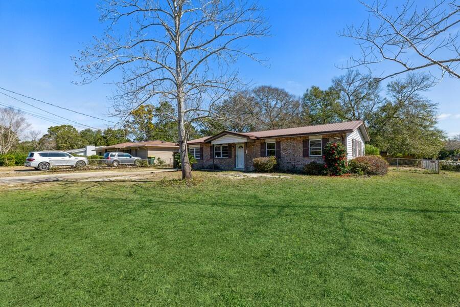 Yours to dream up! This is a spacious open floor plan home to make your own! The living space is oversized! The living space is flowing over to the sun room. Beautiful and full of natural sunlight. Metal roof, newer HVAC, windows have been updated. Buyer to verify all information to be deem true and correct.