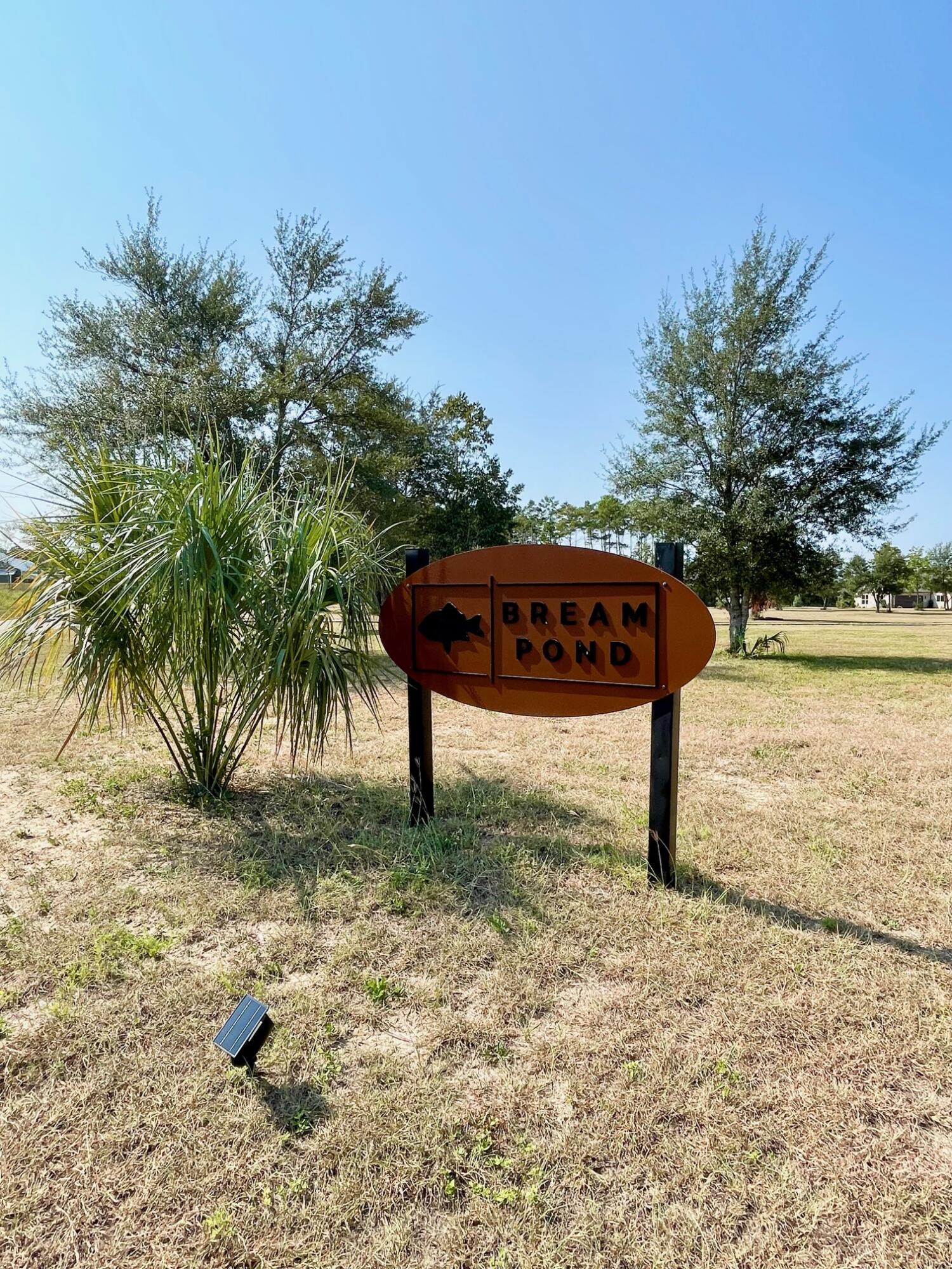 Build your dream home on this stunning lot located in the serene Bream Pond Community. Tucked away in a quiet, picturesque location, Bream Pond offers beautiful homes on large private lots with underground electric. Little Island Lake and Bream Pond surround the community, where you can fish, kayak, or paddle board. Whether you are looking for extra space for an RV, a place to build a weekend getaway or your forever home, this is it. Conveniently located close to Hwy 77, and just a short commute to the beach and all that Panama City Beach has to offer.