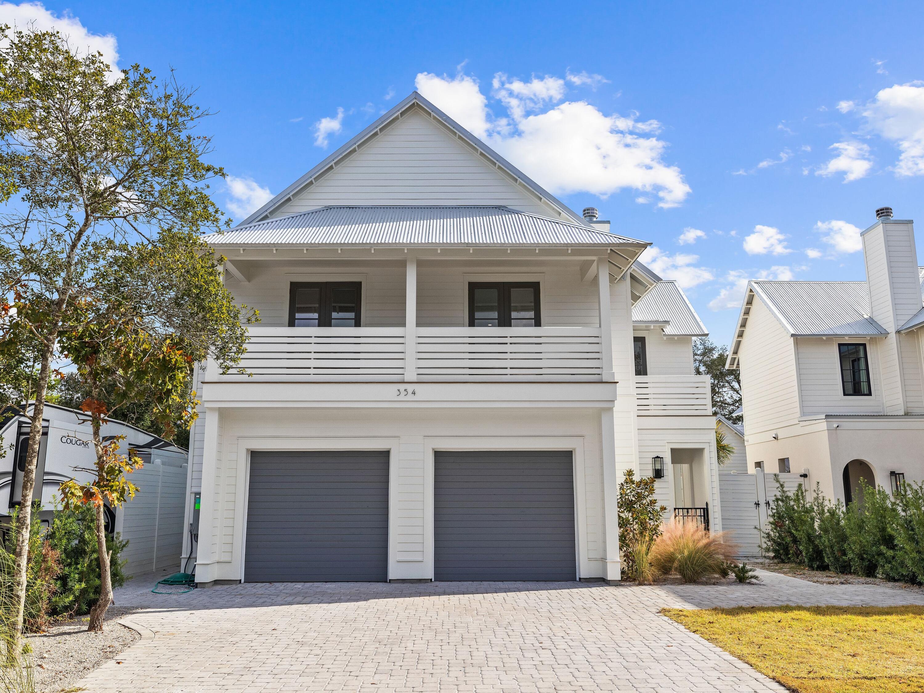 Discover Gulf Shore Manor in Seagrove Beach, where versatility meets elegance. This 3,939-square-foot new construction home caters to investors and full-time residents alike. Six bedrooms and six baths ensure private spaces for everyone, and an attached lockout unit with a separate entrance could be used for extended gatherings or rented on its own. Enjoy the convenience of a Wolf gas range, spacious double-door refrigerator freezer, and the luxury of three laundry rooms. Cozy up by the two gas fireplaces or take a dip in the private swimming pool. With proximity to the beach, restaurants, shops, and Seaside, Florida, this is coastal living at its finest.
