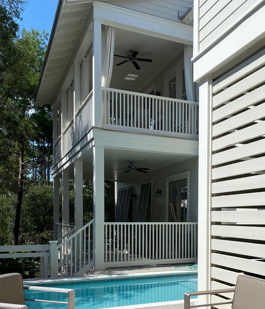 A private pool is one the many additions to this newly renovated home situated in an ideal location near the pathway to Seaside, the beach, Beach Club, tennis courts, Camp Watercolor and is directly opposite a natural preserve with walking trails. Rental projections are $100-150K. The house has an open floor plan with a bright airy kitchen, living and dining areas on the second floor that open to the covered porch with an outdoor living and dining that offers easy entertaining both inside and out. The spacious master suite is located on the second floor and has his and her closets and large bathroom. Two additional bedrooms are located on the first floor along with a large enclosed carport that could easily be converted into additional bedrooms and/or living space that overlooks the pool.