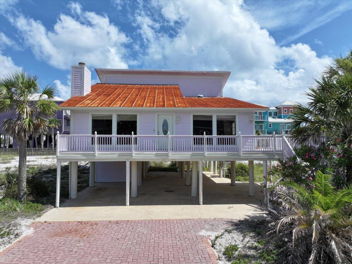 Coastal charm meets opportunity at 8147 White Sands Boulevard in Navarre, FL. Just moments from the stunning shoreline of Navarre Beach, this 3-bedroom, 2-bathroom home offers the ideal setting for relaxed coastal living. With sugar-white sands and emerald waters nearby, the location invites you to enjoy the beauty of the Gulf Coast every day.Inside, you'll find a bright, open-concept layout and a spacious kitchen ready for your choice of appliances. The ground-level storage room offers plenty of space for beach gear, bikes, or equipment to suit a variety of lifestyles. Step outside and enjoy the breeze from generous front and back decks--perfect for quiet mornings or relaxing evenings. The large backyard offers potential for your own outdoor retreat, including room for a pool. Whether you're looking for a full-time residence, a vacation property, or an investment opportunity, this home presents exceptional versatility in a sought-after beachside community. Don't miss your chance to make this coastal gem your own!