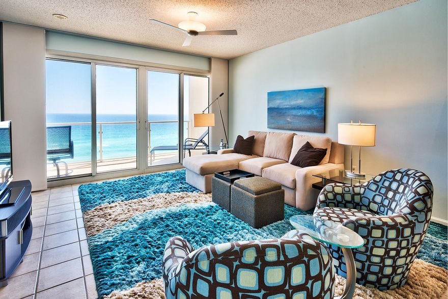 This top floor gulf front penthouse is located in the center stack of Sterling Sands. A non-rental unit since its complete remodel in 2009, its high-end finishes and re-painted walls are in pristine condition. Glass rails maximize views of the Gulf of Mexico from the spacious balcony, spanning the waterfront living room and master bedroom. From its vantage point overlooking the heated pool with spa below, watch Pelicans in flight and Dolphins passing in the emerald gulf waters. Enjoy a closer view with onsite beach chair and umbrella service. The updated kitchen with comfortable counter height bar seating for four features granite counters and stainless steel appliances. continued....