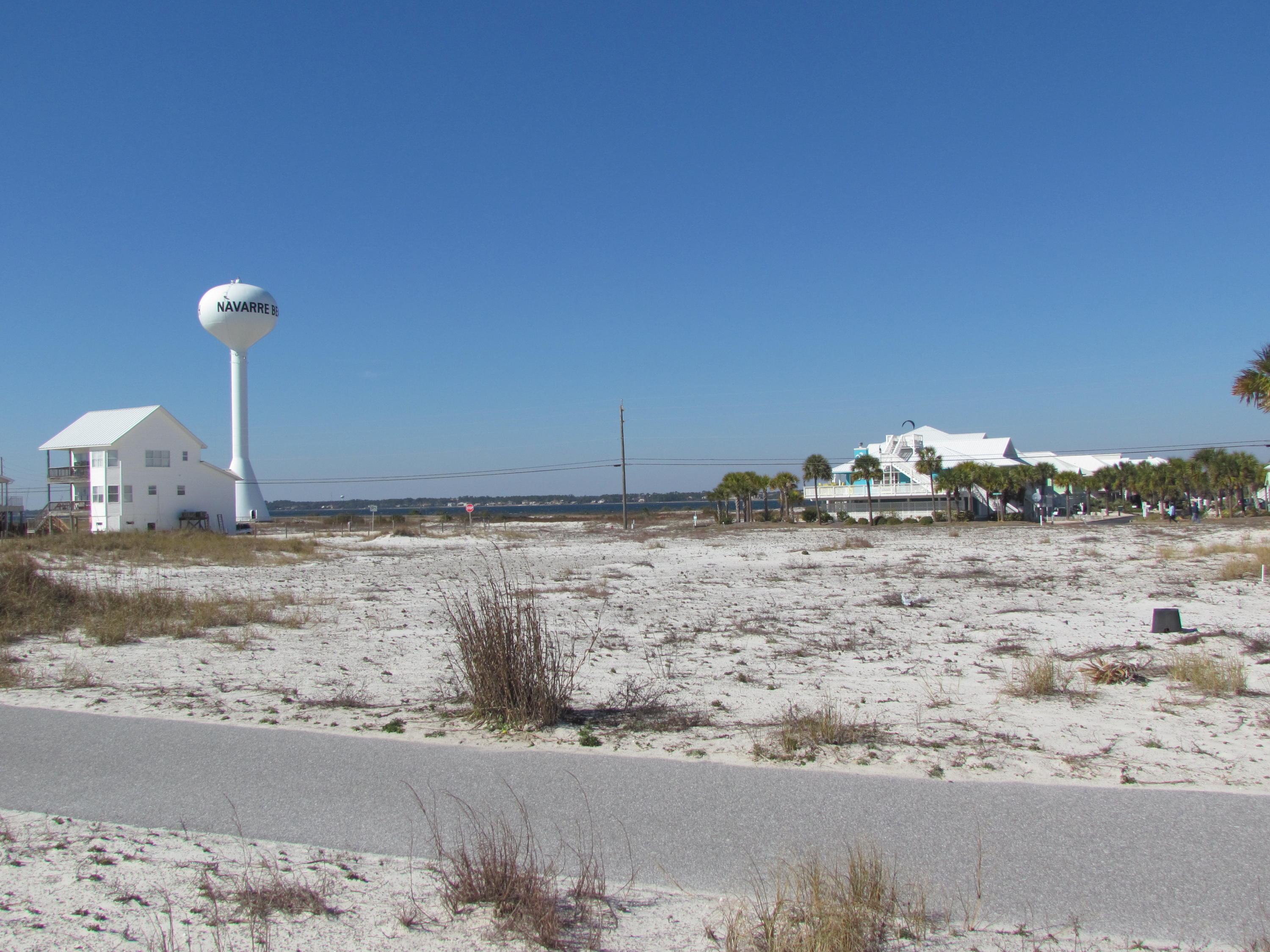 PRICE REDUCED !!!! OWNER SAYS ''BRING OFFERS''. A GREAT lot on the North side of Gulf Blvd. on which to build your dream Bach Home, a Vacation Home, or a Vacation Rental income property. Home will provide great views of the Gulf of Mexico as well as the Santa Rosa Sound. Available Gulf Blvd. lots are quickly decreasing, and good lots such as this are Very Very rare. Please take the opportunity to own your Gulf Blvd. lot on lovely Navarre Beach. Enjoy all the benefits of Navarre Beach at much less cost than neighboring beaches.