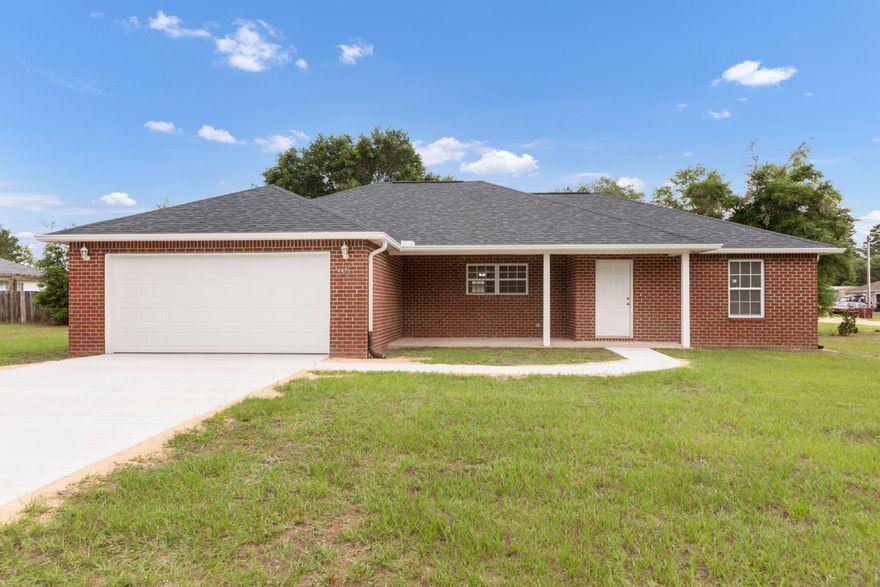 A wonderful starter home or investment is ready and waiting for its new owners.  Situated on a large lot on a paved road is a comfortable and accommodating 3 bedroom, 2 bath home.  No HOA!  The home features a large kitchen with a breakfast bar and an eat-in dining area, all open to the great room.  A split bedroom plan thoughtfully adds privacy and a place to get away.  The master bath has double vanities, garden tub, separate shower, large walkin.Roomy laundry room has both washer/dryer and the 2nd refrigerator (all included).  The owner has made substantial improvements this year to include a new roof, new driveway and walk, new garage door, full gutters, new interior paint and carpet and new water heater coming. All to make your living easy and enjoyable from the minute you move in!