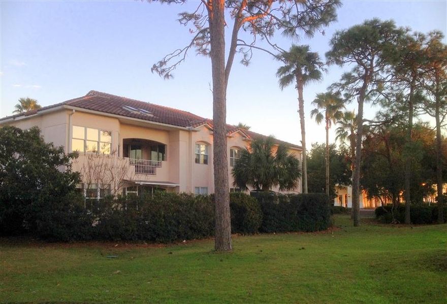 Lives like a spacious house with walls of windows! One level, no stairs. Two screened rooms open to courtyard & tumbled marble patio. Quality throughout! Kitchen w/Stainless & Granite. High ceilings, 8ft doors, crown molding, central vac, custom lighting & window treatments. Construction is Hebel aerated concrete block & steel=low utility bills. 2,443 Sq Ft of living space incl the screened rooms & a finished garage that's great for gym or crafts. Home has an open floor plan w/options for Formal Dining/Family Rm/Den/Ofc. Dues include Lender-required insurances (a mortgage pymt savings), golf membership, landscaping, maintenance, security gate. Two parklike acres adjacent to golfcourse and gorgeous huge HOA Pool, Beach & reservable Clubhouse. Clean, bright, well-maintained, move-in ready!