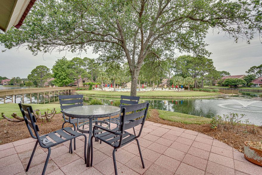 The end unit location & views are top notch with this Beachwalk townhome! Spend hours relaxing on your private patio gazing over the lake & pool while listening to the sounds of the lake fountain and families splashing in the pool. Conveniently located next to the crossover leading directly to the pool and just a 1/4 miles to the beach. This floor plan offers a bedroom on the main floor with an enclosed courtyard patio PLUS a loft and bedroom on the 2nd floor. There's tons of storage space with an indoor attic, walk-in master closet, walk-in linen closet and an outdoor enclosed yard storage. This home has never been on a rental program and used only for personal family & friends. It's been well kept & well loved for many years. Now it's time to make it your personal resort paradise!